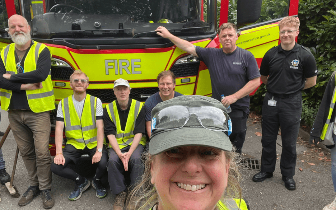 EPIKS volunteers and Fire and Rescue service crew in front of fire truck